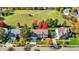 Overhead view of the home with colorful fall trees, lush green lawn, and proximity to a green common area at 12396 Dellfield W Blvd, Carmel, IN 46033