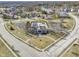 Aerial view of neighborhood clubhouse, pool and basketball court with well-maintained landscaping at 12396 Dellfield W Blvd, Carmel, IN 46033