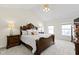 Spacious primary bedroom with a vaulted ceiling, a ceiling fan, and natural lighting at 12396 Dellfield W Blvd, Carmel, IN 46033