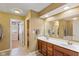 Bathroom with a double sink vanity, large mirror, and separate toilet and shower room at 13504 E 131St St, Fishers, IN 46037