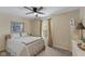 Inviting bedroom with a ceiling fan, plush carpeting, and a cozy ambiance at 13504 E 131St St, Fishers, IN 46037