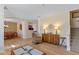 Open living area with hardwood floors, transitional furnishings, and seamless flow to the dining room at 13504 E 131St St, Fishers, IN 46037