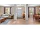 Bright living room with hardwood floors, neutral paint, and open floor plan, adjacent to dining area at 13504 E 131St St, Fishers, IN 46037