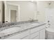 Bright bathroom with dual sinks, a granite countertop, and white cabinets at 14383 Coyote Ridge Dr, Noblesville, IN 46060