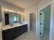 Elegant bathroom with double vanity, marble floors, and modern lighting at 14383 Coyote Ridge Dr, Noblesville, IN 46060