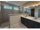 Modern bathroom featuring a double vanity, tiled shower, and marble floors at 14383 Coyote Ridge Dr, Noblesville, IN 46060
