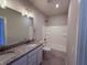 Bathroom featuring single vanity, quartz countertops, and shower-tub combo with white tile at 14383 Coyote Ridge Dr, Noblesville, IN 46060