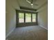 Cozy bedroom with carpet and natural light from three large windows at 14383 Coyote Ridge Dr, Noblesville, IN 46060