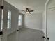 Neutrally decorated bedroom with plush carpeting, natural light, and modern ceiling fan at 14383 Coyote Ridge Dr, Noblesville, IN 46060
