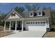 Charming single-Gathering home features a covered front porch and a two-car garage at 14383 Coyote Ridge Dr, Noblesville, IN 46060