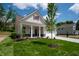 Charming home featuring a well-kept lawn, inviting front porch, and a two-car attached garage at 14383 Coyote Ridge Dr, Noblesville, IN 46060