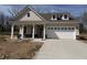 Charming single-story home with inviting front porch, attached garage, and a well-lit driveway at 14383 Coyote Ridge Dr, Noblesville, IN 46060