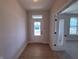 Bright entry foyer boasts hardwood floors and a view of the backyard through a glass door at 14383 Coyote Ridge Dr, Noblesville, IN 46060