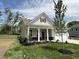 Inviting single-Gathering home featuring a covered porch, fresh landscaping, and a well-maintained front yard at 14383 Coyote Ridge Dr, Noblesville, IN 46060