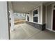 Inviting covered front porch with stone accents and ample space for seating at 14383 Coyote Ridge Dr, Noblesville, IN 46060
