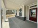 Inviting front porch features classic columns and stone accents, offering a welcoming entrance at 14383 Coyote Ridge Dr, Noblesville, IN 46060