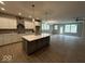 Modern kitchen featuring a large island, stainless appliances, and sleek countertops at 14383 Coyote Ridge Dr, Noblesville, IN 46060