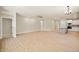 Open floor plan view from kitchen to spacious living room featuring hardwood floors and bright lighting at 14383 Coyote Ridge Dr, Noblesville, IN 46060