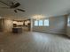 Spacious living room boasts wood floors and an open layout with a ceiling fan at 14383 Coyote Ridge Dr, Noblesville, IN 46060