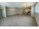 Open floor plan showing spacious living area with wood floors leading to the kitchen at 14383 Coyote Ridge Dr, Noblesville, IN 46060