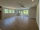 Bright living area with wood-look floors and natural light from multiple windows at 14383 Coyote Ridge Dr, Noblesville, IN 46060