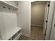 Convenient mudroom with a built-in bench, coat hooks, and storage cubbies at 14383 Coyote Ridge Dr, Noblesville, IN 46060