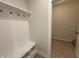 Mudroom with a white bench and coat hooks, and vinyl flooring at 14383 Coyote Ridge Dr, Noblesville, IN 46060