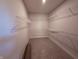 Spacious walk-in closet with wire shelving for organized storage and carpet at 14383 Coyote Ridge Dr, Noblesville, IN 46060