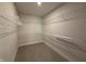 Spacious walk-in closet with carpet and metal shelving for ample storage at 14383 Coyote Ridge Dr, Noblesville, IN 46060