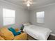 Comfortable bedroom with natural light, and couch, offering a cozy retreat at 1459 E Lynn Dr, Indianapolis, IN 46202