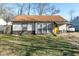 Charming single-story home featuring a new roof, bright yellow door, and well-maintained front yard at 1459 E Lynn Dr, Indianapolis, IN 46202