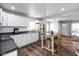 Modern kitchen features stainless steel appliances, white cabinets, and laminate floors at 1459 E Lynn Dr, Indianapolis, IN 46202