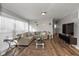 Bright living room with hardwood floors, neutral walls, and comfortable sectional sofa at 1459 E Lynn Dr, Indianapolis, IN 46202