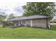 Backyard showing a patio area with seating and a stone-exterior home at 1459 S Josephine St, Martinsville, IN 46151