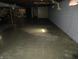 Unfinished basement featuring concrete walls and floors, with visible pipes and utilities at 1459 S Josephine St, Martinsville, IN 46151