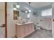 Charming bathroom with pink vanity, stylish sink and white tiled walls at 1459 S Josephine St, Martinsville, IN 46151