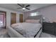 Comfortable bedroom with a tufted headboard bed, fresh pink walls, and neutral carpet at 1459 S Josephine St, Martinsville, IN 46151