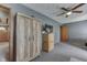 A bedroom with wood floors, carpet, a ceiling fan and lots of storage at 1459 S Josephine St, Martinsville, IN 46151