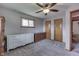 A spacious bedroom with neutral paint, carpet, and a ceiling fan at 1459 S Josephine St, Martinsville, IN 46151