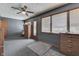 Comfortable bedroom with a ceiling fan, wooden furnishings, and carpet at 1459 S Josephine St, Martinsville, IN 46151