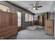 A bedroom with multiple storage options, carpet and a ceiling fan at 1459 S Josephine St, Martinsville, IN 46151