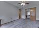 Spacious bedroom with neutral paint, carpet, and access to other rooms at 1459 S Josephine St, Martinsville, IN 46151