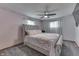 Cozy bedroom showcasing a tufted headboard bed, soft pink walls, and neutral carpet at 1459 S Josephine St, Martinsville, IN 46151