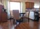 Charming dining area featuring hardwood floors and a view into the kitchen, perfect for Gathering meals at 1459 S Josephine St, Martinsville, IN 46151