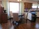 Cozy dining area with seating for four, bathed in natural light from a window overlooking the yard at 1459 S Josephine St, Martinsville, IN 46151