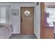 Inviting entryway featuring a wood door with a decorative window and a neutral color palette at 1459 S Josephine St, Martinsville, IN 46151