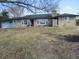 Charming stone home with a well-maintained lawn and a classic chimney at 1459 S Josephine St, Martinsville, IN 46151