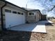 Side view of the home with newly installed driveway and well-maintained landscaping at 1459 S Josephine St, Martinsville, IN 46151