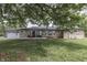 Charming stone ranch home with a well-maintained front yard and an attached two-car garage at 1459 S Josephine St, Martinsville, IN 46151