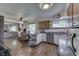 Open-concept kitchen and dining area with wood cabinets, stainless appliances, and stylish flooring at 1459 S Josephine St, Martinsville, IN 46151